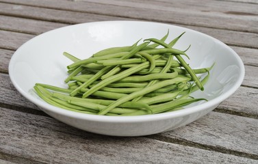 Plate of French green beans freshly picked from the vegetable garden