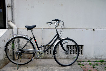 Fototapeta na wymiar Old black bicycle in vintage style