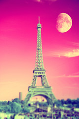 summer evening moon over the Eiffel Tower symbol of Paris