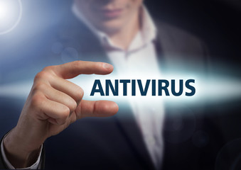 Businessman presses button antivirus on virtual screens. Busines