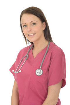 Portrait Of A Beautiful Young Female Doctor Wearing Pink Theatre Scrubs