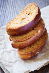 rusks with nuts on a wooden background