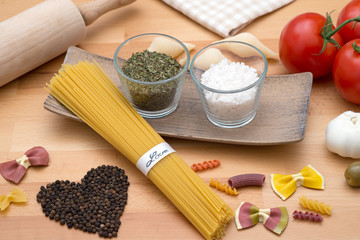 different types of pasta and other ingredients for an italian meal