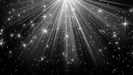 light rays and stars on black background