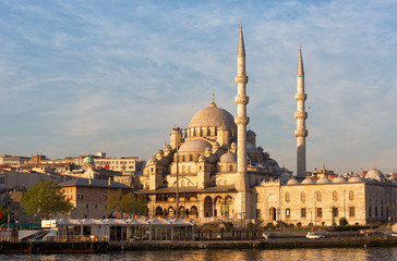 Fototapeta na wymiar Yeni Cami, meaning New Mosque lit with the morning sun, Istanbul