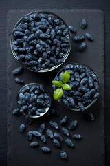 Above view of ripe honeysuckle berries, close-up, studio shot