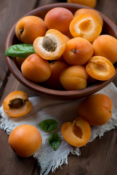 Close-up of ripe apricots in a ceramic bowl, selective focus