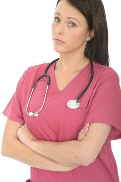 Portrait Of A Beautiful Young Female Doctor Looking With Disbelief