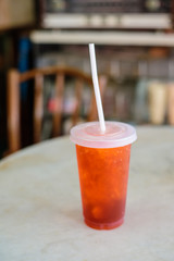 Fresh ice tea in plastic glass