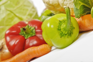 Fresh vegetables: green and red pepper, carrot, cabbage, onion and cauliflower.