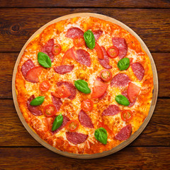 Delicious pizza with salami and cherry tomatoes