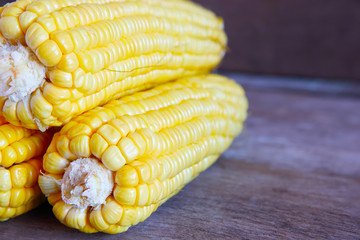 Corns on Wooden Background.