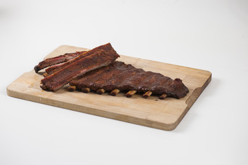 Spare ribs on wooden plate