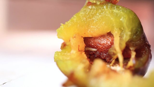 worm in the fruit eats plum