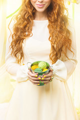 Girl holding basket with balls
