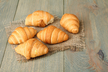 Croissants on a wooden background