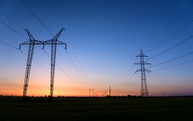 Large transmission towers at blue hour 