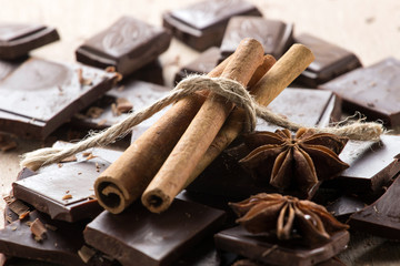 Chocolate with cinnamon sticks and star anise, selective focus