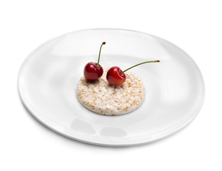 Two cherries on a plate