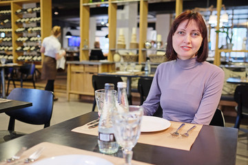 Woman sitting in the restaurant