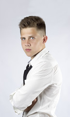 a young man, a student, brunette, gray eyes, white shirt