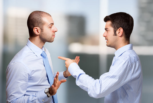 Businessman scolding a colleague