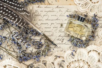 vintage ink pen, perfume, lavender flowers and old love letters