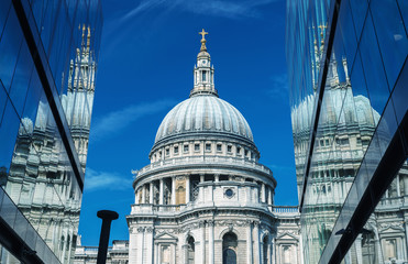 London. St Paul Cathedral reflected in modern glass on a beautif