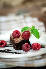 Chocolate brownie  with raspberry and mint