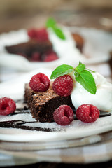 Chocolate brownie  with raspberry and mint