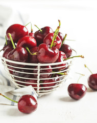 Fresh sweet cherry in glass cup