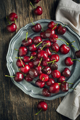 Sweet cherry on vintage plate. Top view
