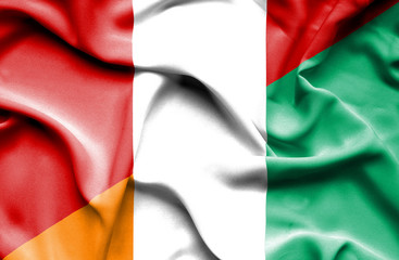 Waving flag of Ivory Coast and Peru