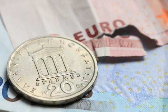 Greek coins on euro notes