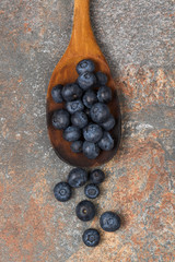 Blueberries on a wooden spoon