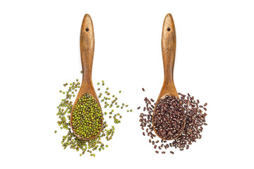 Mung beans and red beans in wooden spoon isolated on white