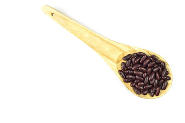 Red beans in wooden spoon isolated on white