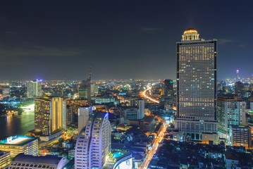 Modern building at riverside in twilight scene at Bangkok, Thailand