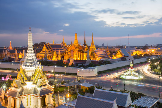 The beauty of the Emerald Buddha Temple at twilight. And while the gold of the temple catching the light. This is an important buddhist temple of thailand and a famous tourist destination.