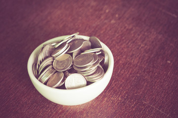 Coin in the cup with filter effect retro vintage style