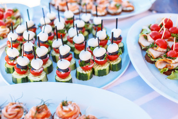 Snacks on white plates.