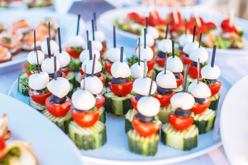 Snacks on white plates.