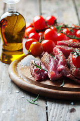 Uncooked meat with herbs and salt