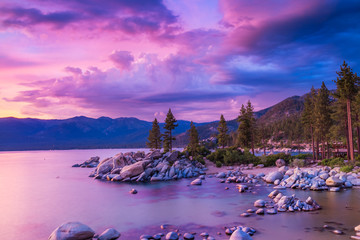 Sunset over Lake Tahoe with stormy clouds over sierra nevada mountains, dramatic sky