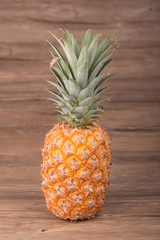 Pineapple on wooden grunge background