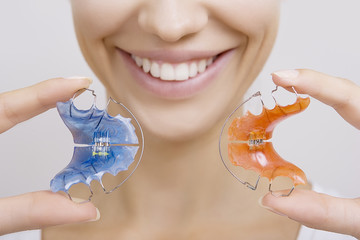 Beautiful Smiling Girl with Retainer for Teeth