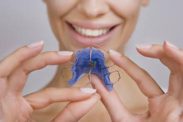 Beautiful Smiling Girl with Retainer for Teeth, Close-up