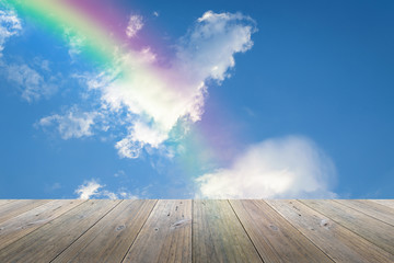 Wood terrace and Blue sky with rainbow