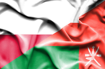Waving flag of Oman and Poland