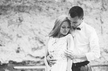 wedding couple near rock